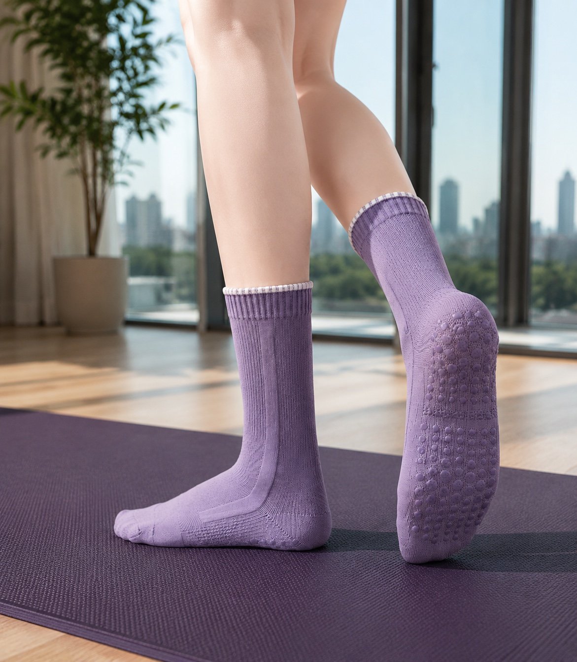 Purple grip socks shown on a purple exercise mat